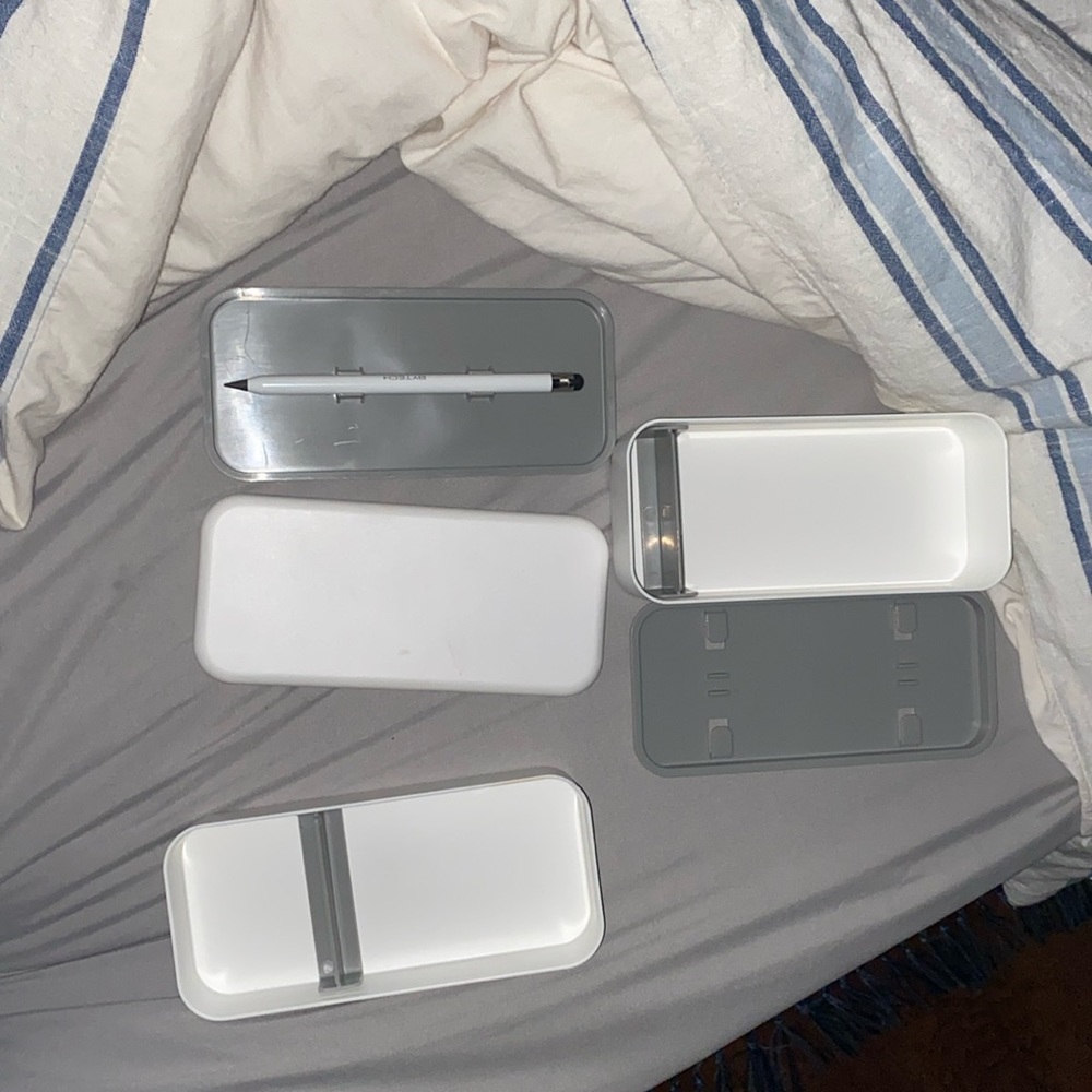 A storage for cables, Apple Watch bands, Apple, pen, and chargers